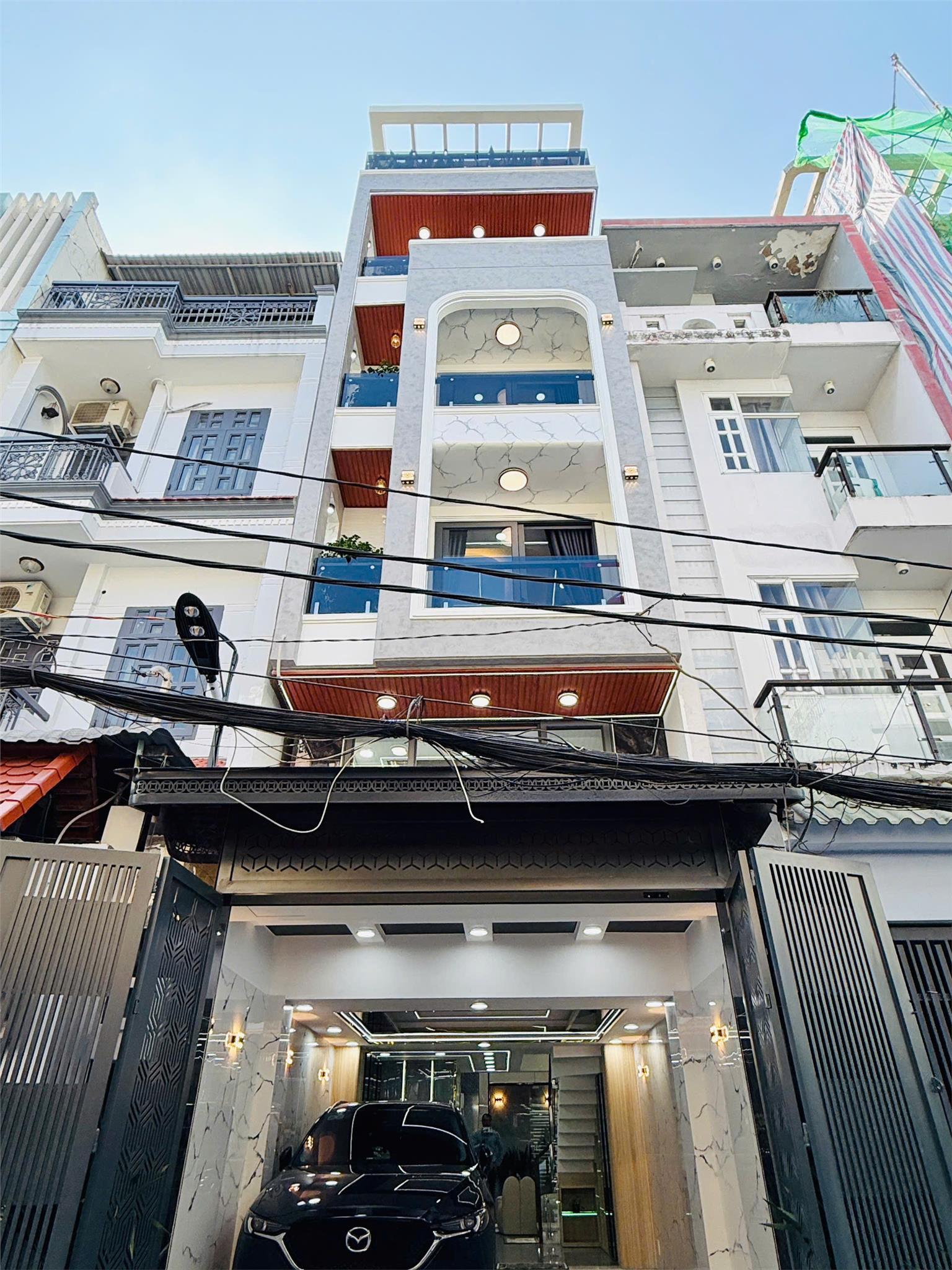 Cần  bán gấp căn nhà 1 trệt 1 lửng 4 lầu - thang máy, gara-  Phan Huy Ích - P.14 Gò Vấp - HCM